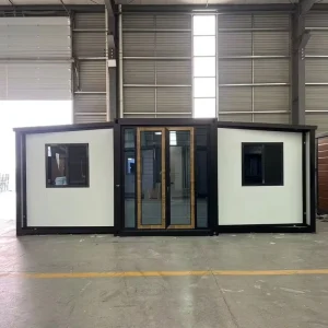 Modern Expandable Container Home with Wood Accent Door and Black Frame Windows for Residential Living and Garden Office